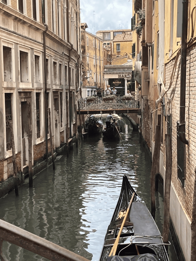 a canal with gondolas in venice italy