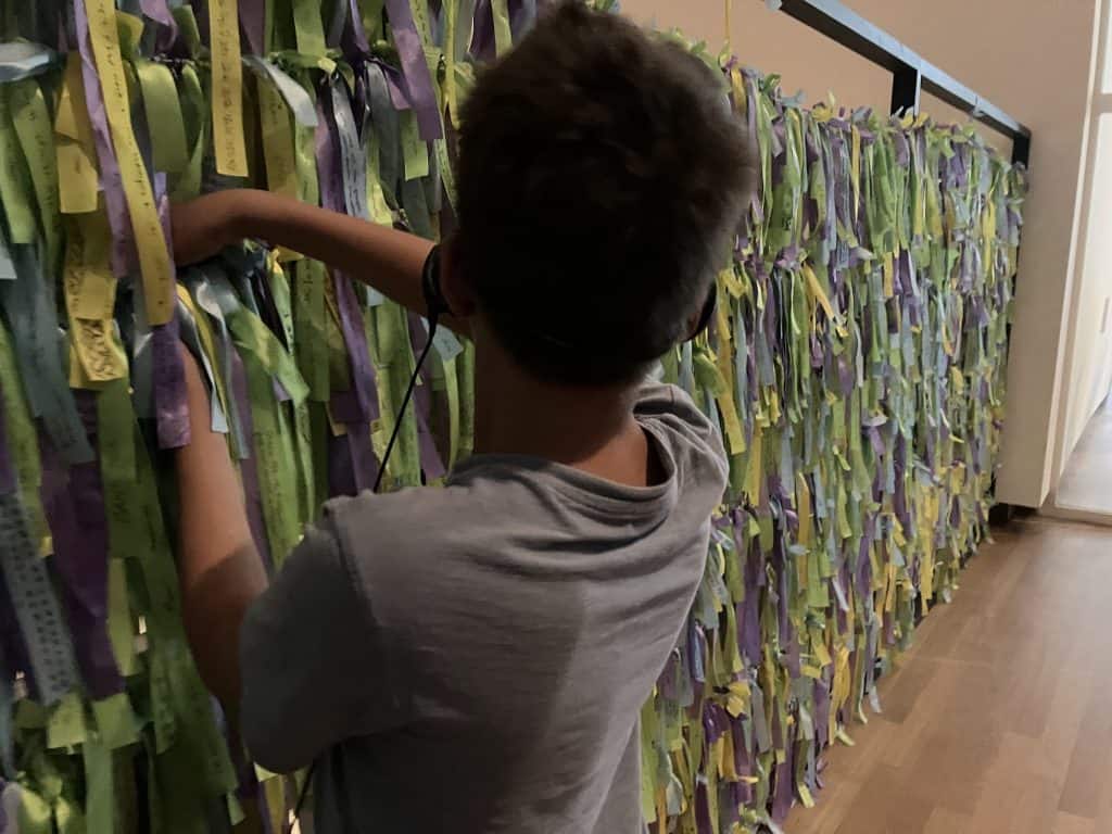 hanging ribbons on a van gogh museum exhibit