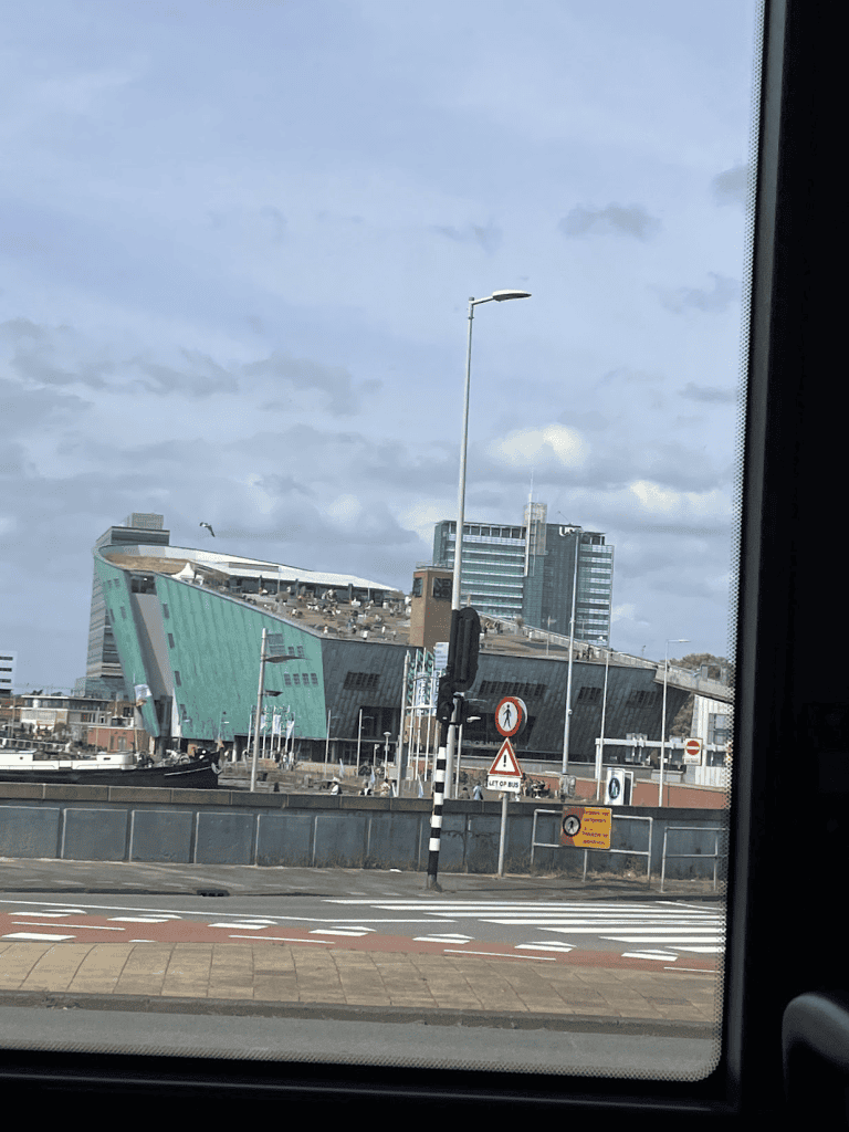 a view of the nemo science museum from the bus, showing the rooftop playground 