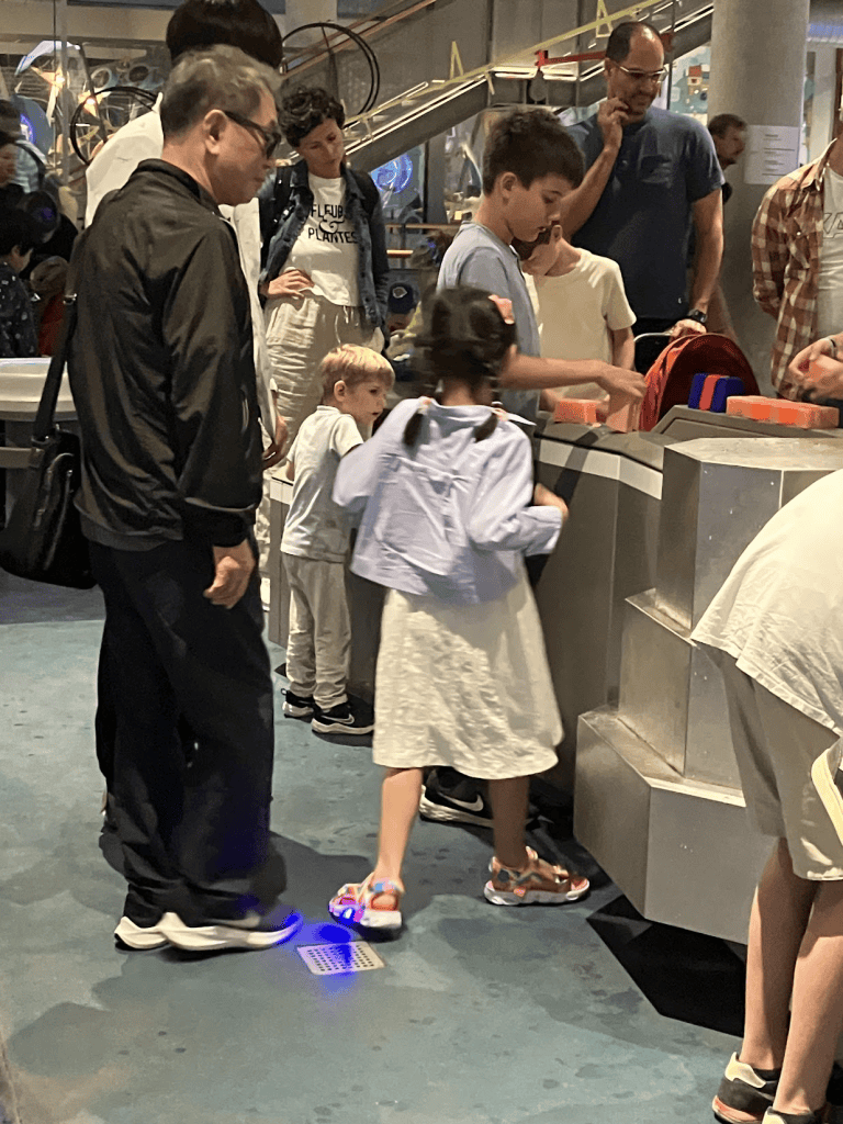 my kids at the nemo science museum playing at a water actvity