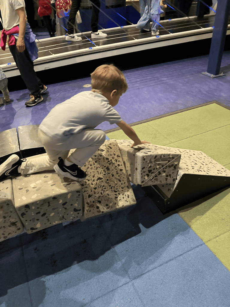 my son playing at a kids construction activity at the Nemo science museum