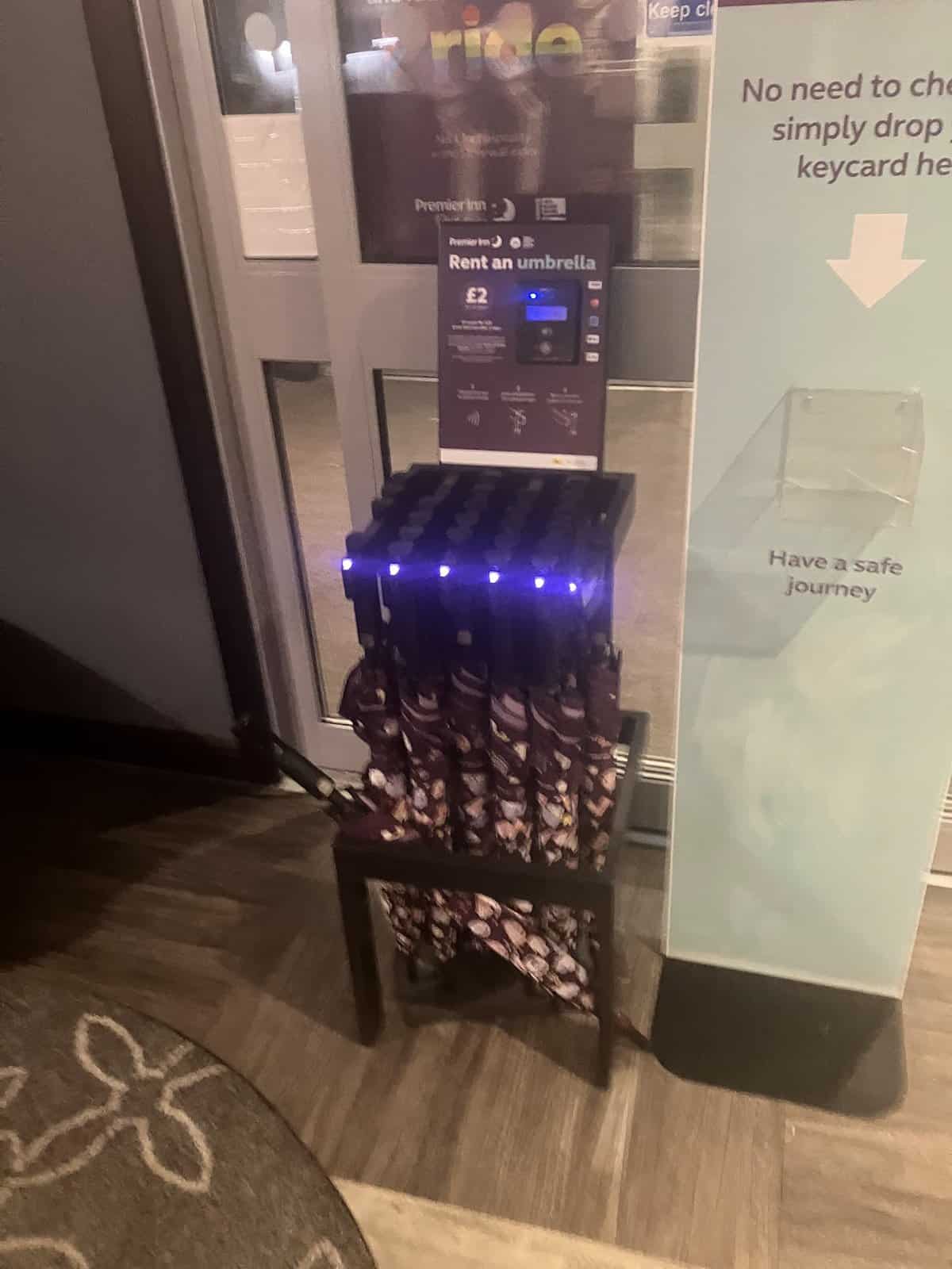 umbrellas for sell in an automated machine at premier inn